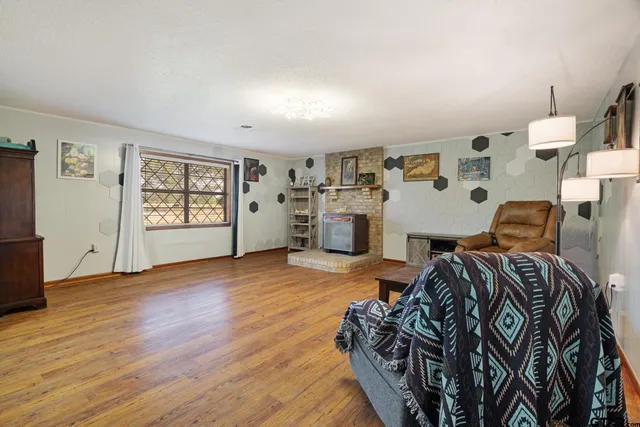 a view of a livingroom with furniture and wooden floor