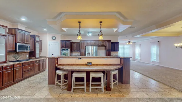 a dining table with chairs and cabinets