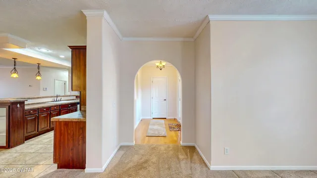 a view of a kitchen cabinets and a wooden floor