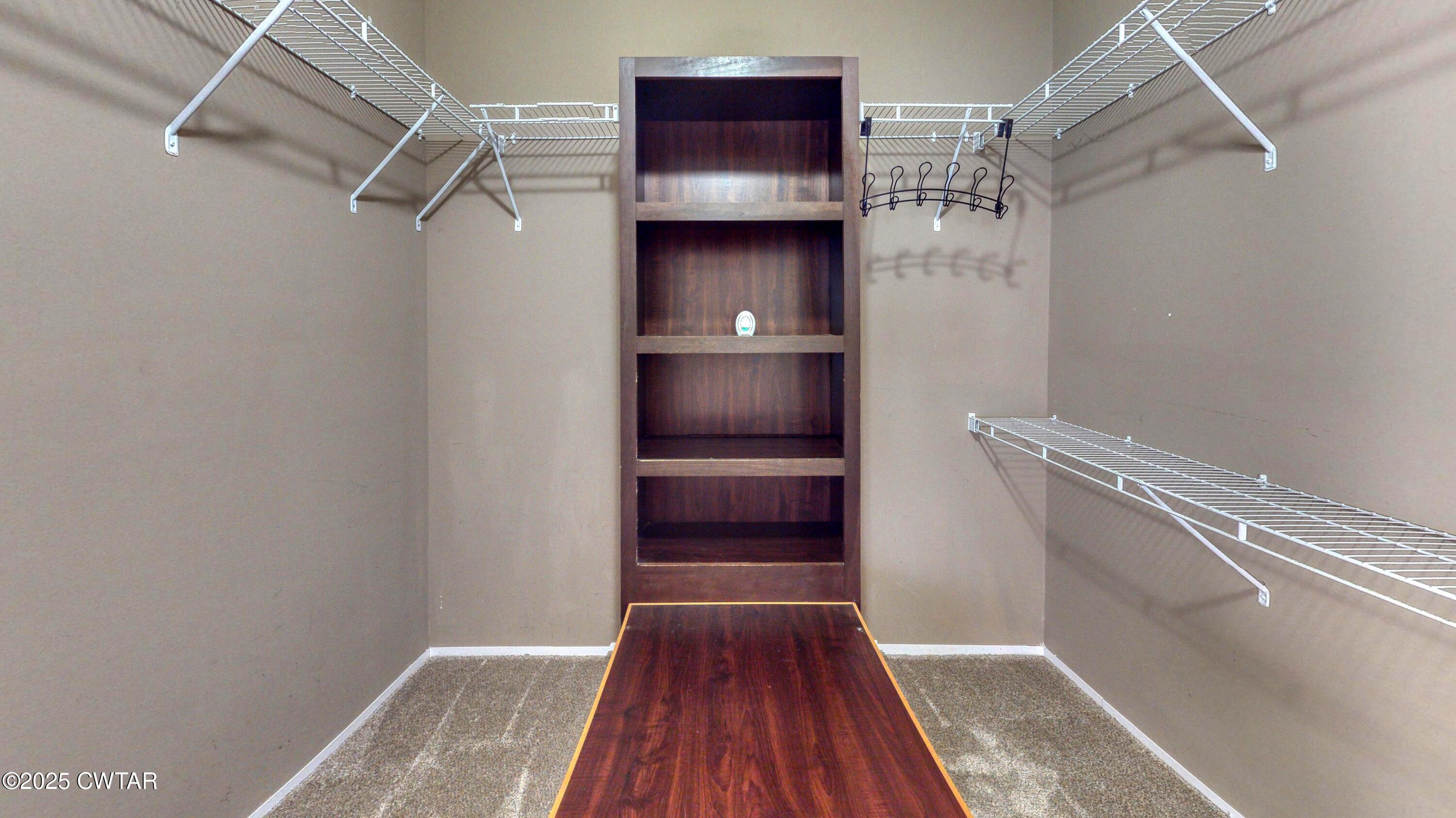 555 Brandon Road Huntingdon, TN 38344 - Photo 26 of 41 a view of walk in closet with wooden floor