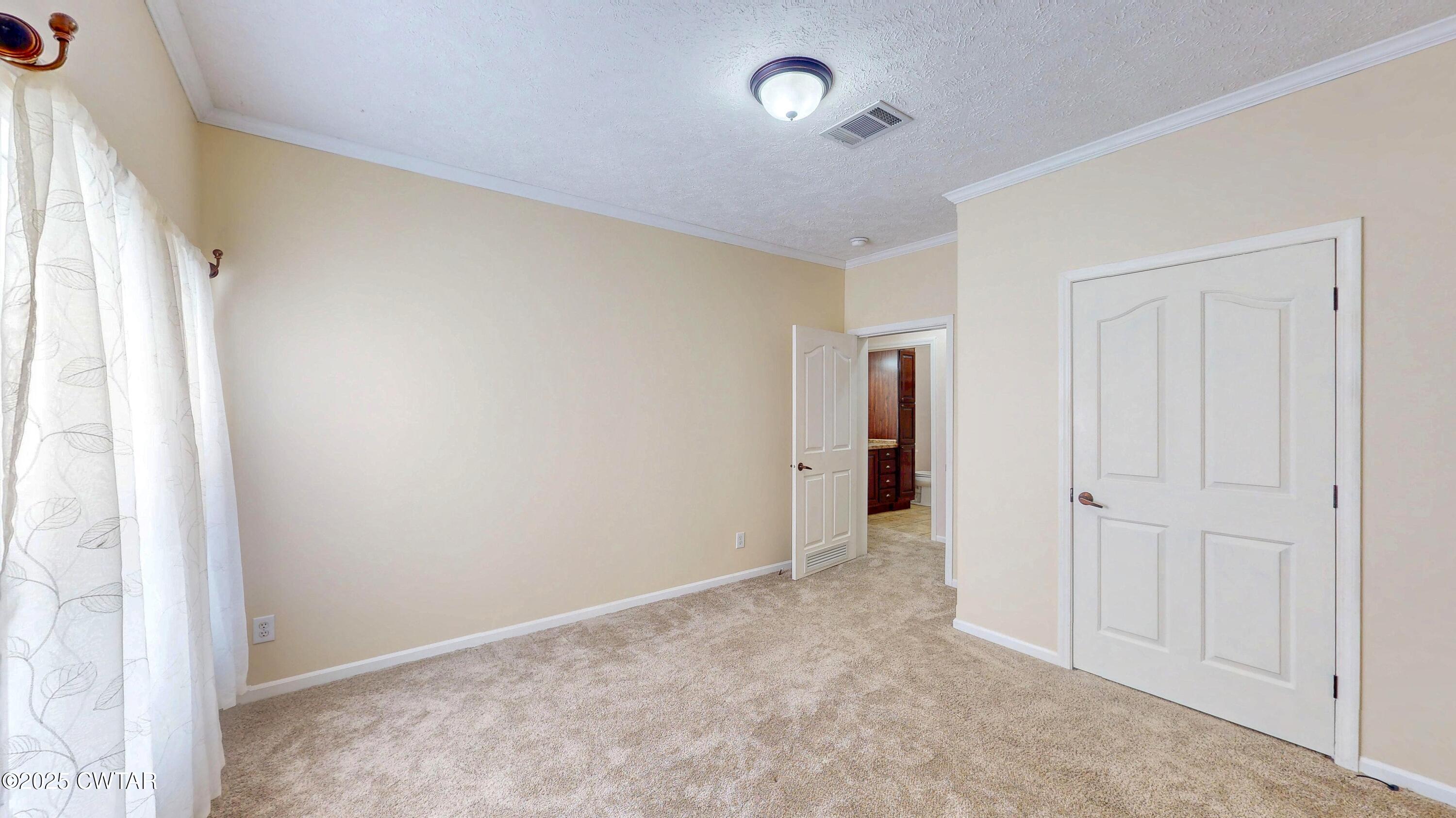 555 Brandon Road Huntingdon, TN 38344 - Photo 27 of 41 an empty room with windows and closet