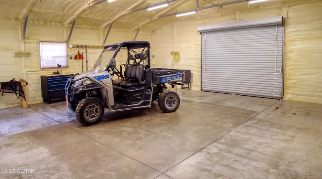 a view of a garage with parked cars