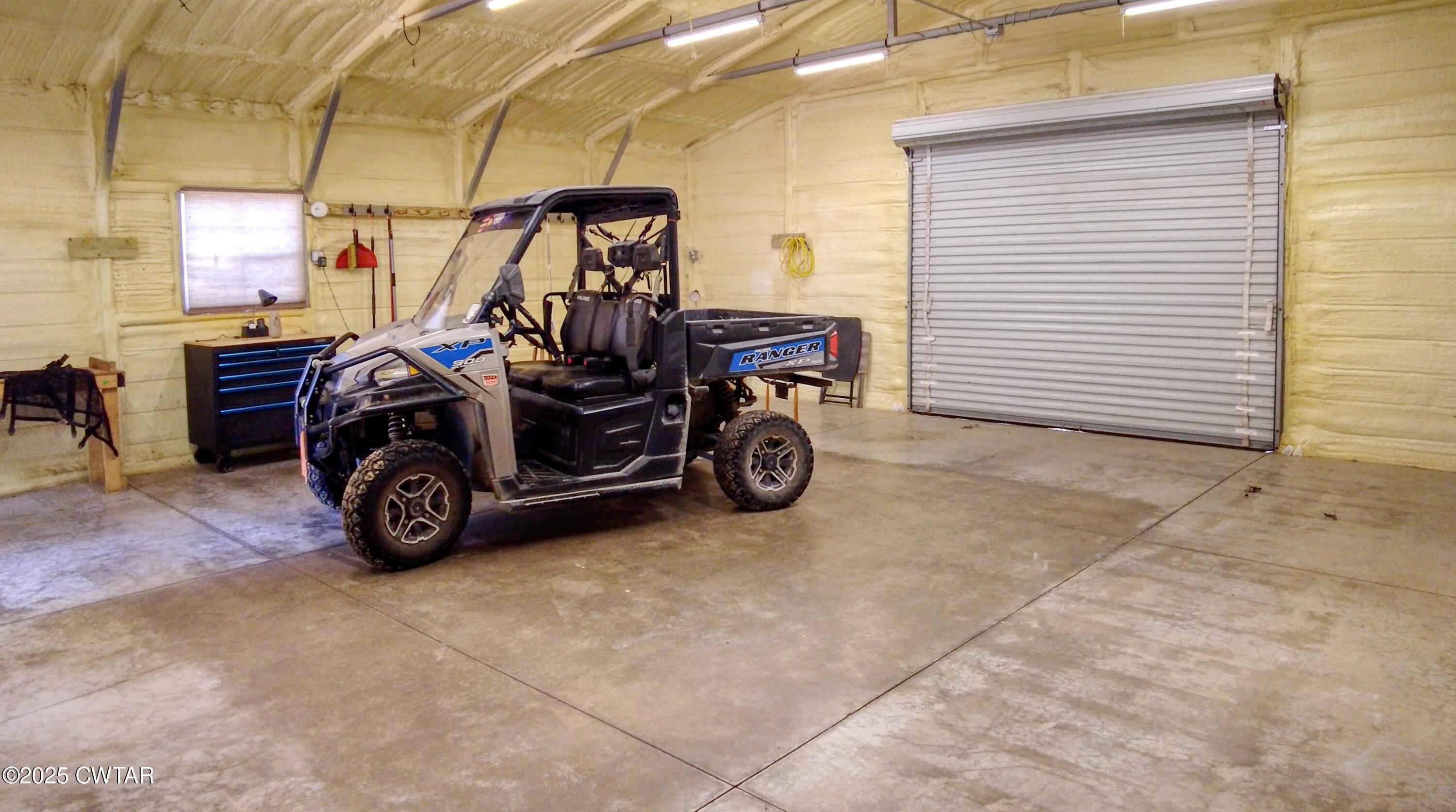 555 Brandon Road Huntingdon, TN 38344 - Photo 34 of 41 a view of a garage with parked cars