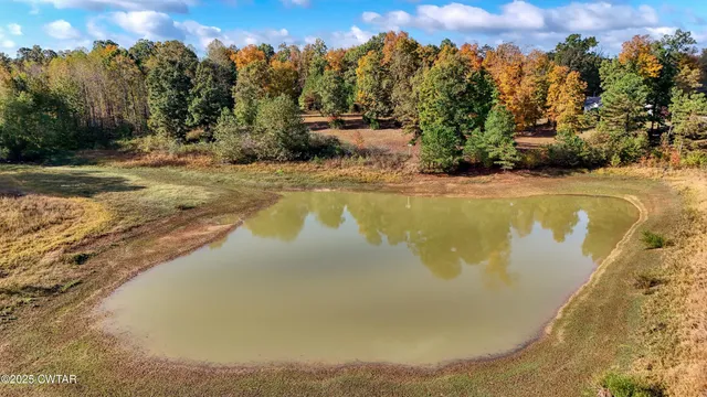 a view of a swimming pool with an outdoor space and seating area