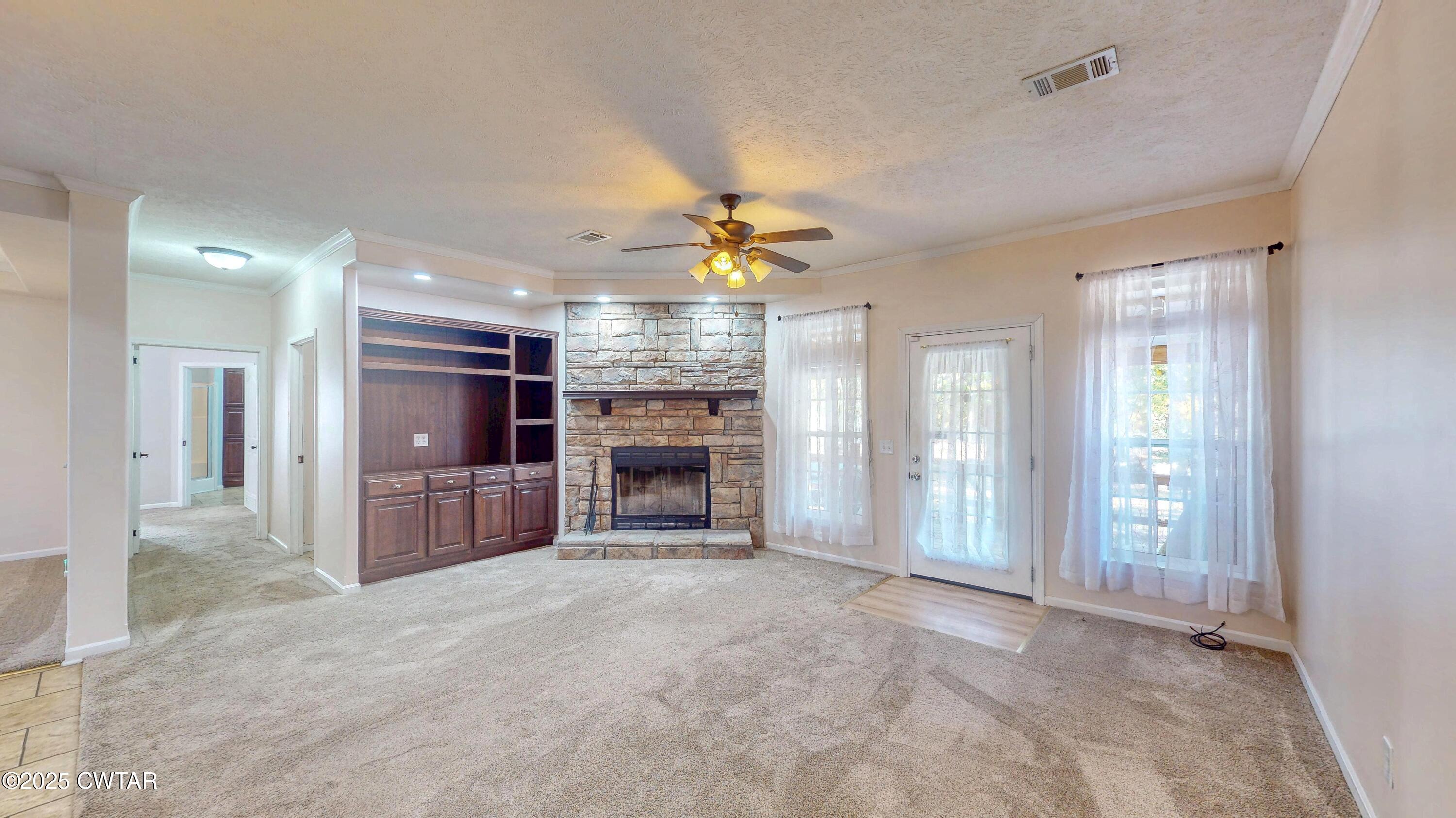 555 Brandon Road Huntingdon, TN 38344 - Photo 9 of 41 a view of a livingroom with a fireplace and window