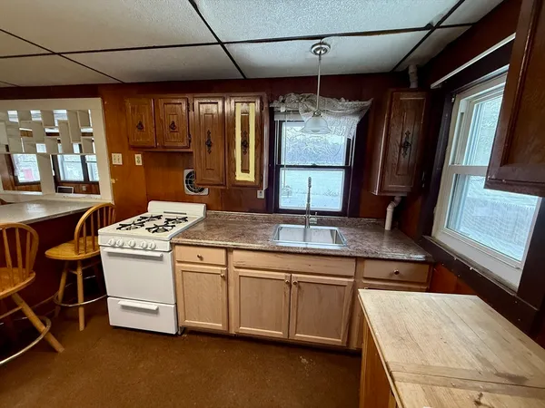 a kitchen that has a sink and a stove