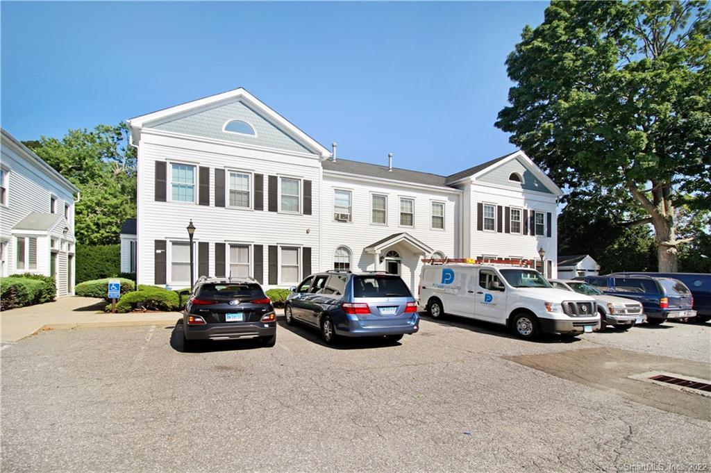 67 Cherry Street, Unit R4 Milford, CT 06460 - Photo 1 of 1 a car parked in front of a white building