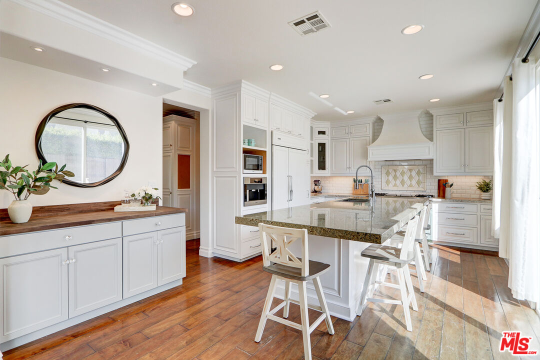 2008 Las Estrellas Court Camarillo, CA 93012 - Photo 16 of 63 a kitchen with white cabinets and sink