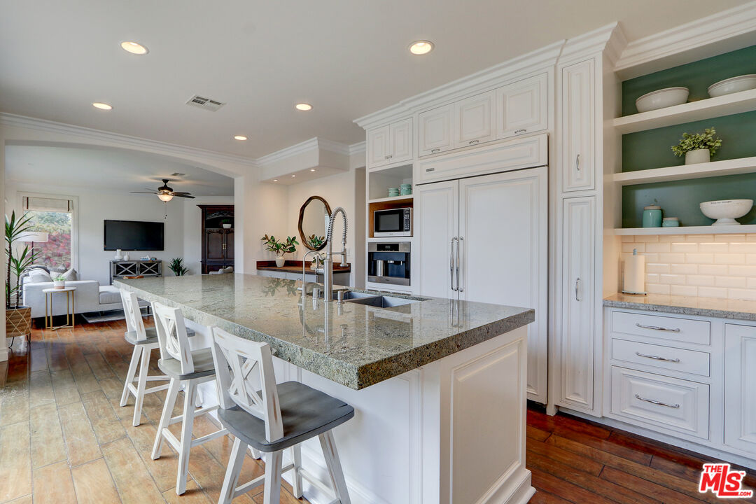 2008 Las Estrellas Court Camarillo, CA 93012 - Photo 18 of 63 a kitchen with stainless steel appliances granite countertop a sink and a refrigerator