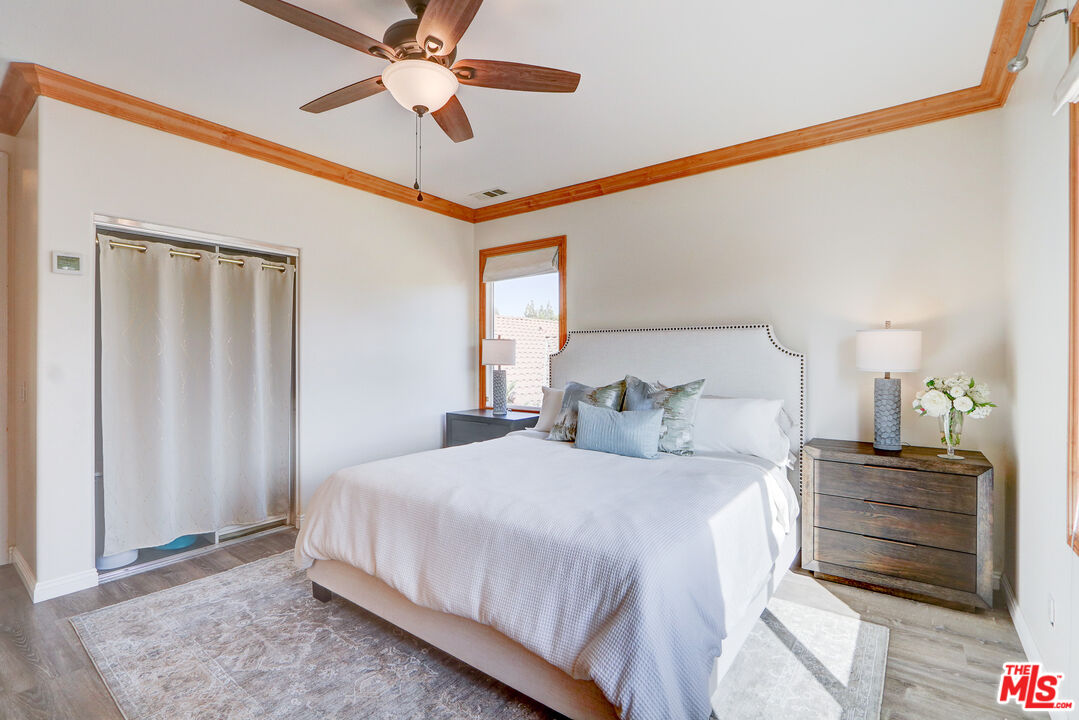 2008 Las Estrellas Court Camarillo, CA 93012 - Photo 21 of 63 a bedroom with bed and a chandelier