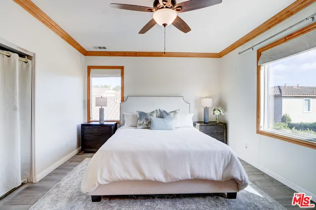 a bathroom with a sink vanity granite tub and a mirror