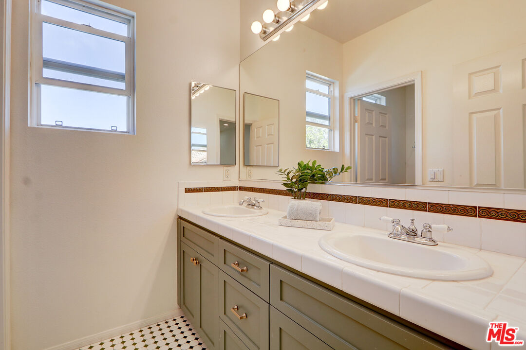 2008 Las Estrellas Court Camarillo, CA 93012 - Photo 29 of 63 a bathroom with a sink and a mirror