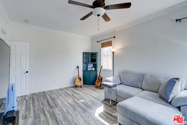 a view of a backyard with table and chairs and wooden fence