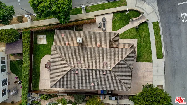 an aerial view of residential house and outdoor space
