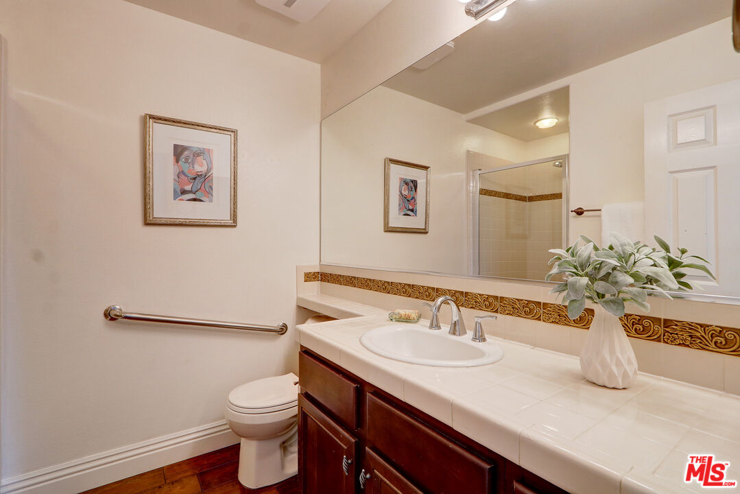 2008 Las Estrellas Court Camarillo, CA 93012 - Photo 10 of 63 a bathroom with a granite countertop sink and a toilet