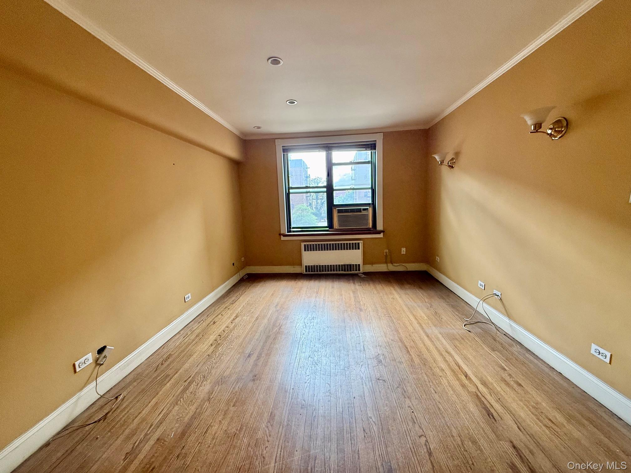 112-50 Northern Boulevard, Unit 3B Queens, NY 11368 - Photo 4 of 20 Large living room with double panel windows, hardwood floors, recessed lighting