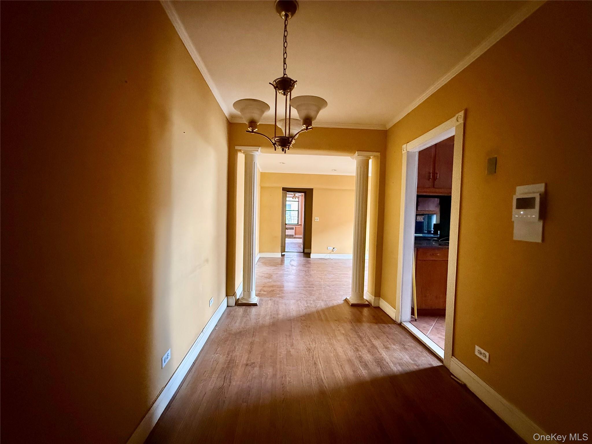 112-50 Northern Boulevard, Unit 3B Queens, NY 11368 - Photo 5 of 20 Large dining area, 2 coat closets at the entrance, hardwood floors, hanging chandelier