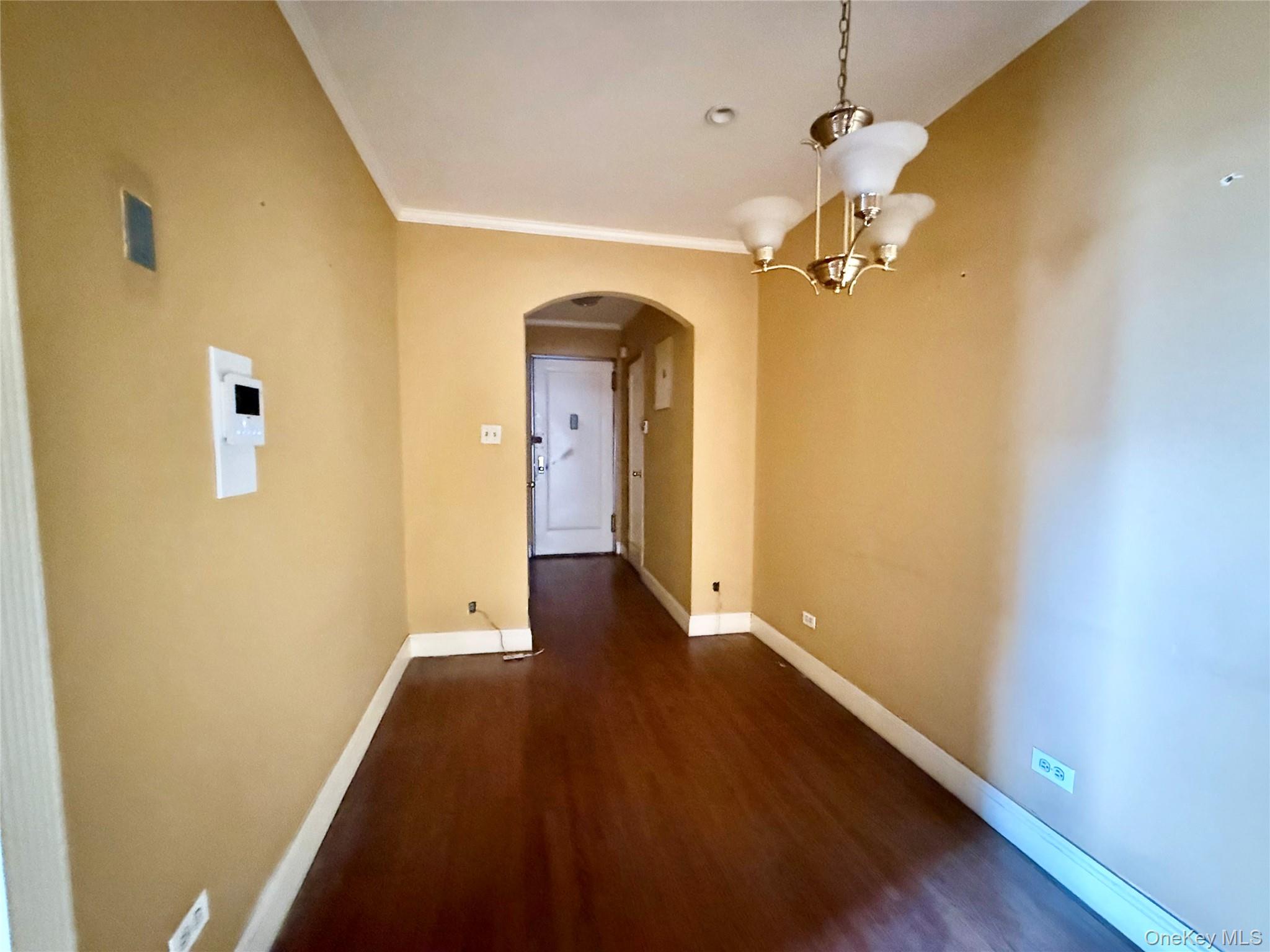 112-50 Northern Boulevard, Unit 3B Queens, NY 11368 - Photo 6 of 20 Large dining area, 2 coat closets at the entrance, hardwood floors, hanging chandelier