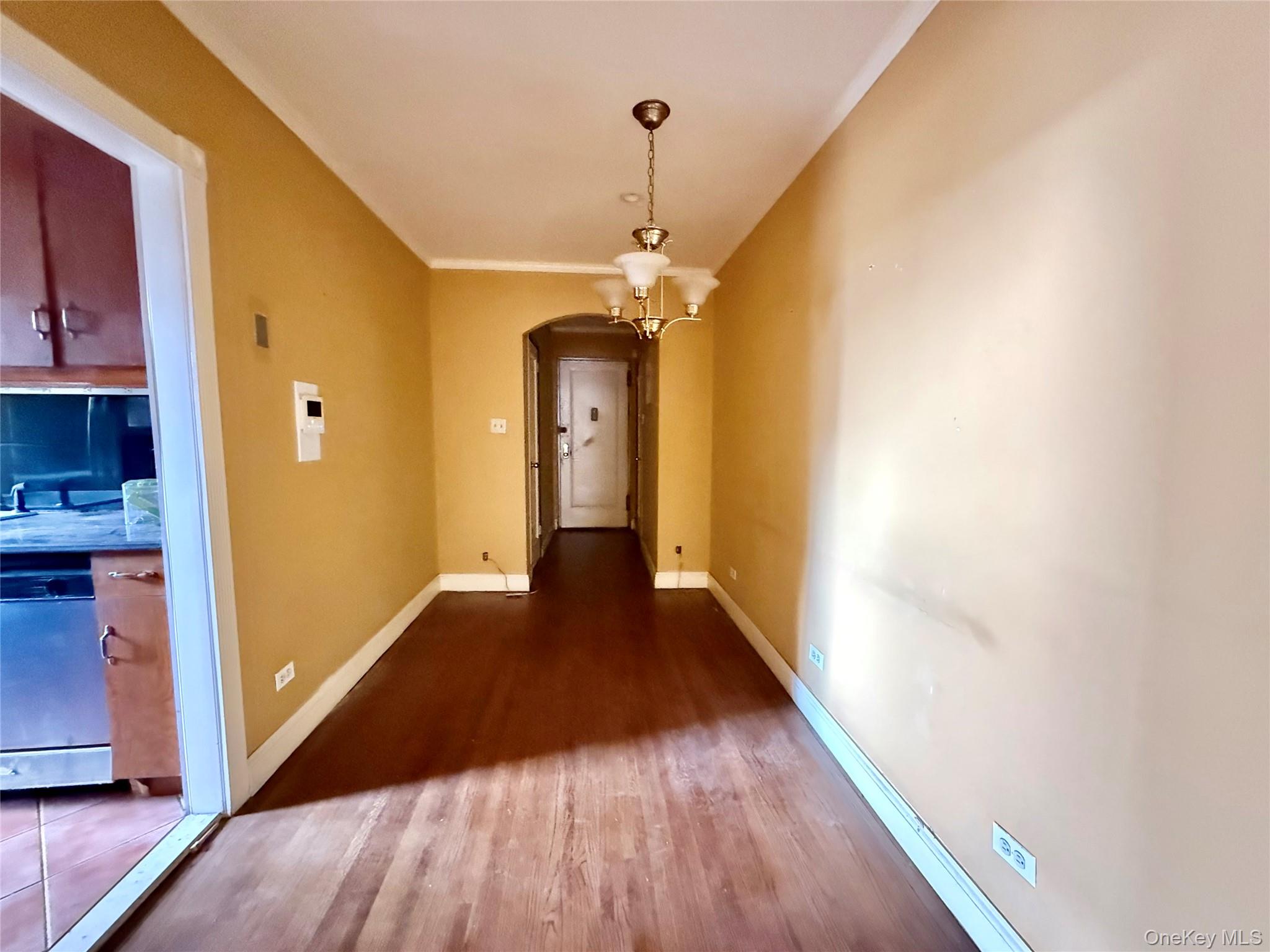 112-50 Northern Boulevard, Unit 3B Queens, NY 11368 - Photo 7 of 20 Large dining area, 2 coat closets at the entrance, hardwood floors, hanging chandelier