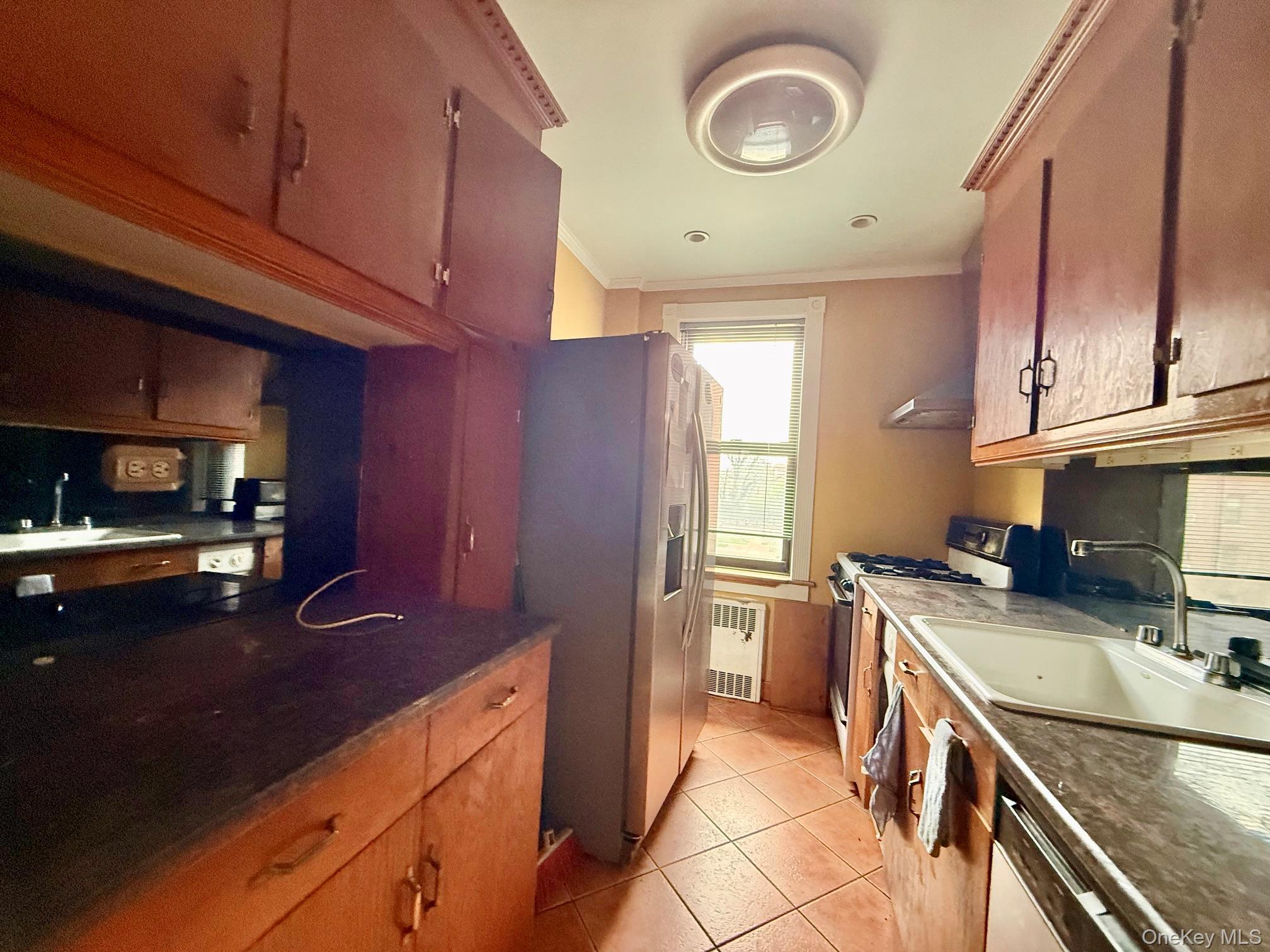 112-50 Northern Boulevard, Unit 3B Queens, NY 11368 - Photo 8 of 20 kitchen updated but needs TLC. Large window for ventilation, tile floors