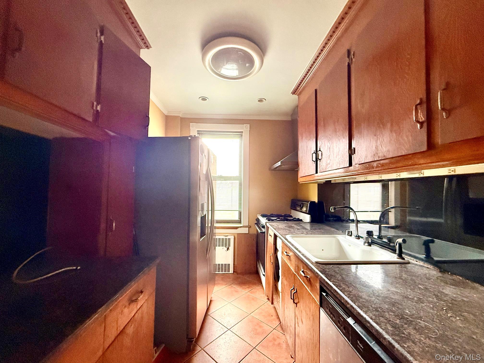 112-50 Northern Boulevard, Unit 3B Queens, NY 11368 - Photo 9 of 20 kitchen updated but needs TLC. Large window for ventilation, tile floors