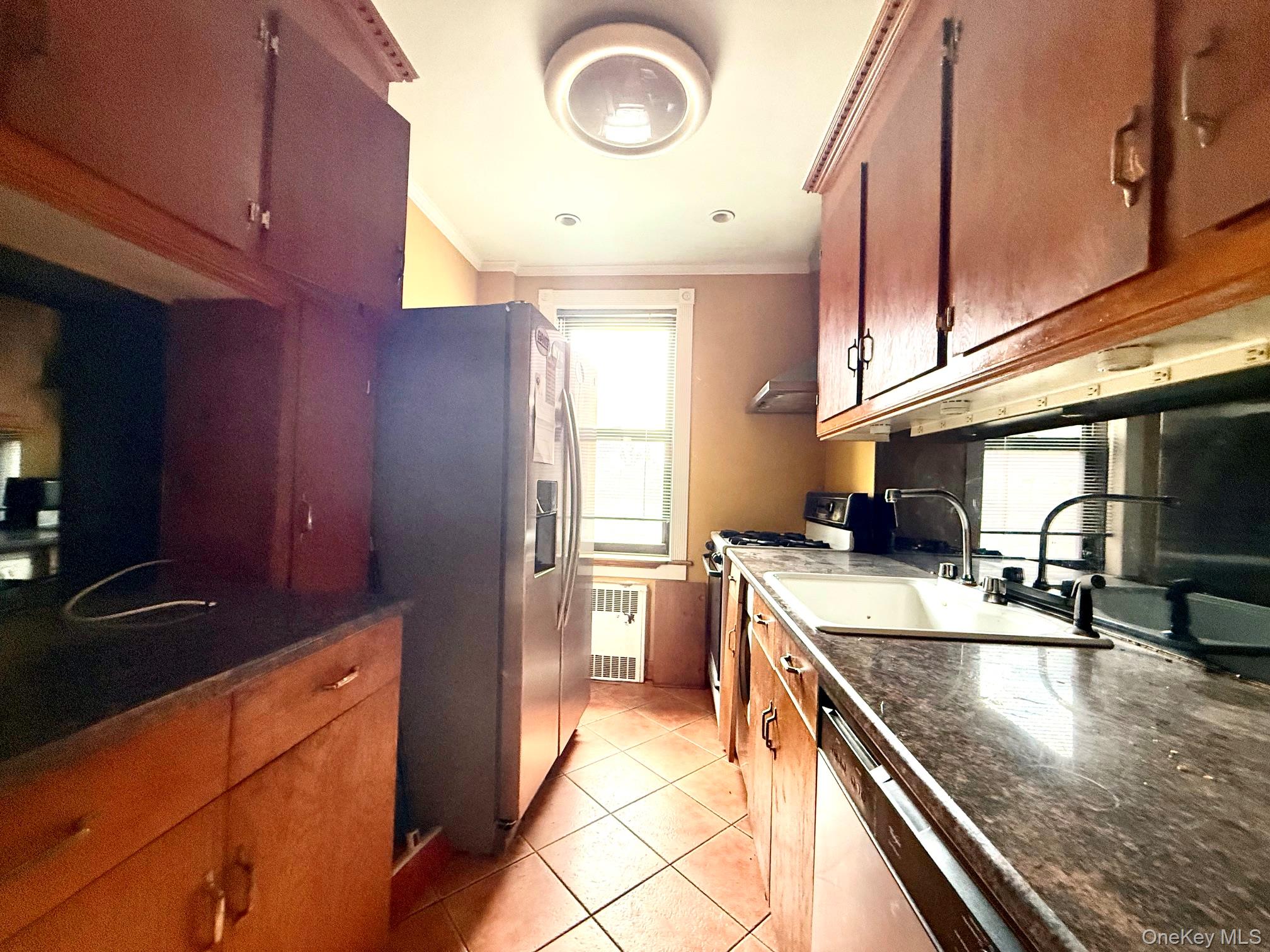 112-50 Northern Boulevard, Unit 3B Queens, NY 11368 - Photo 10 of 20 kitchen updated but needs TLC. Large window for ventilation, tile floors
