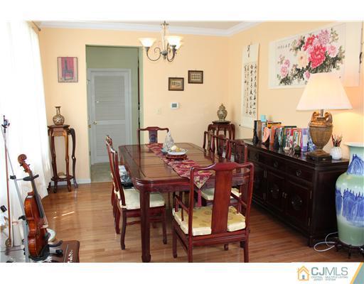 17 Potomac Road Monmouth Junction, NJ 08852 - Photo 3 of 19 a dining room with furniture and wooden floor