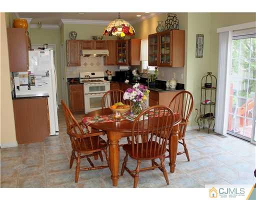 17 Potomac Road Monmouth Junction, NJ 08852 - Photo 4 of 19 a view of a dining room with furniture and chandelier