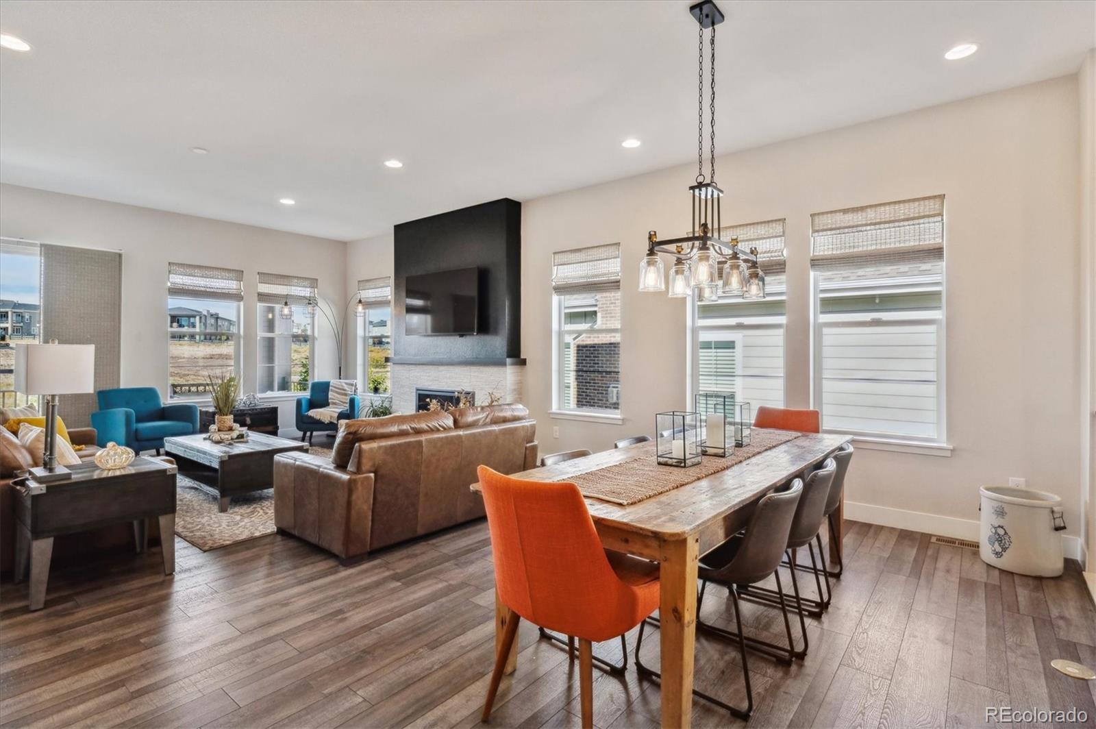2095 Rim Ridge Drive Castle Pines, CO 80108 - Photo 14 of 46 a view of a dining room with furniture window and wooden floor