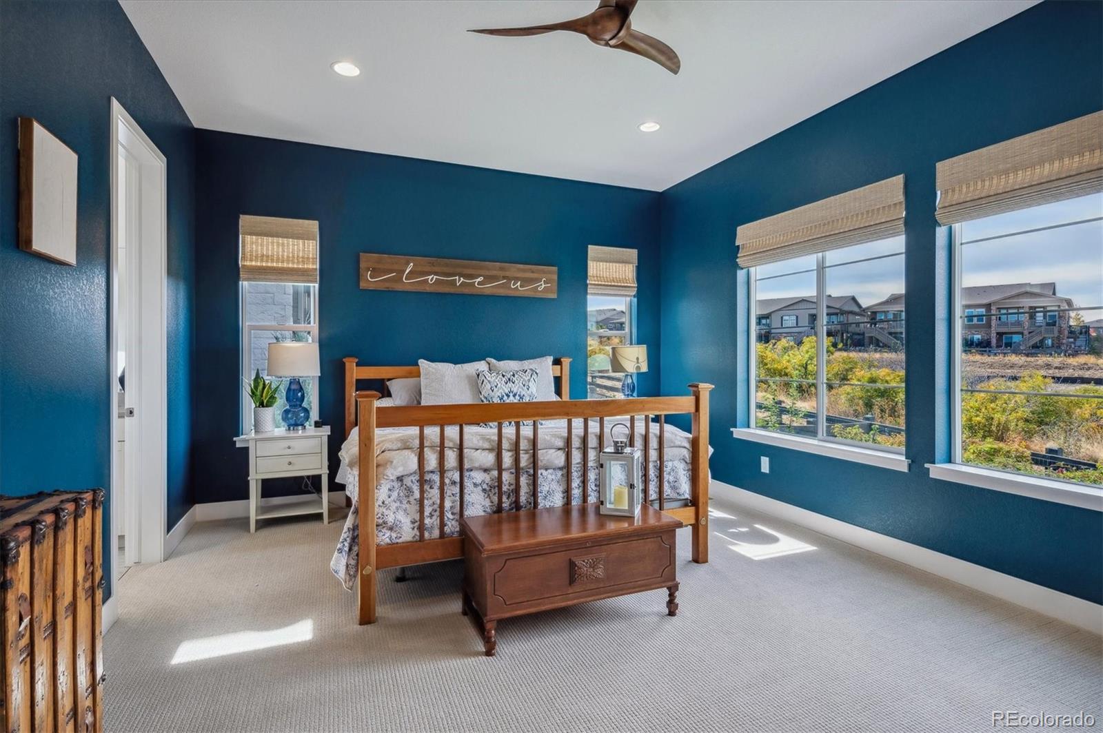 2095 Rim Ridge Drive Castle Pines, CO 80108 - Photo 19 of 46 a bed sitting in a room next to a window