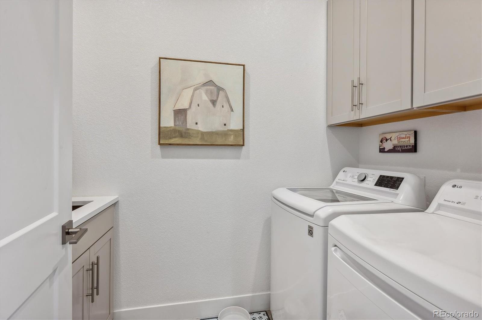 2095 Rim Ridge Drive Castle Pines, CO 80108 - Photo 26 of 46 a utility room with dryer and washer