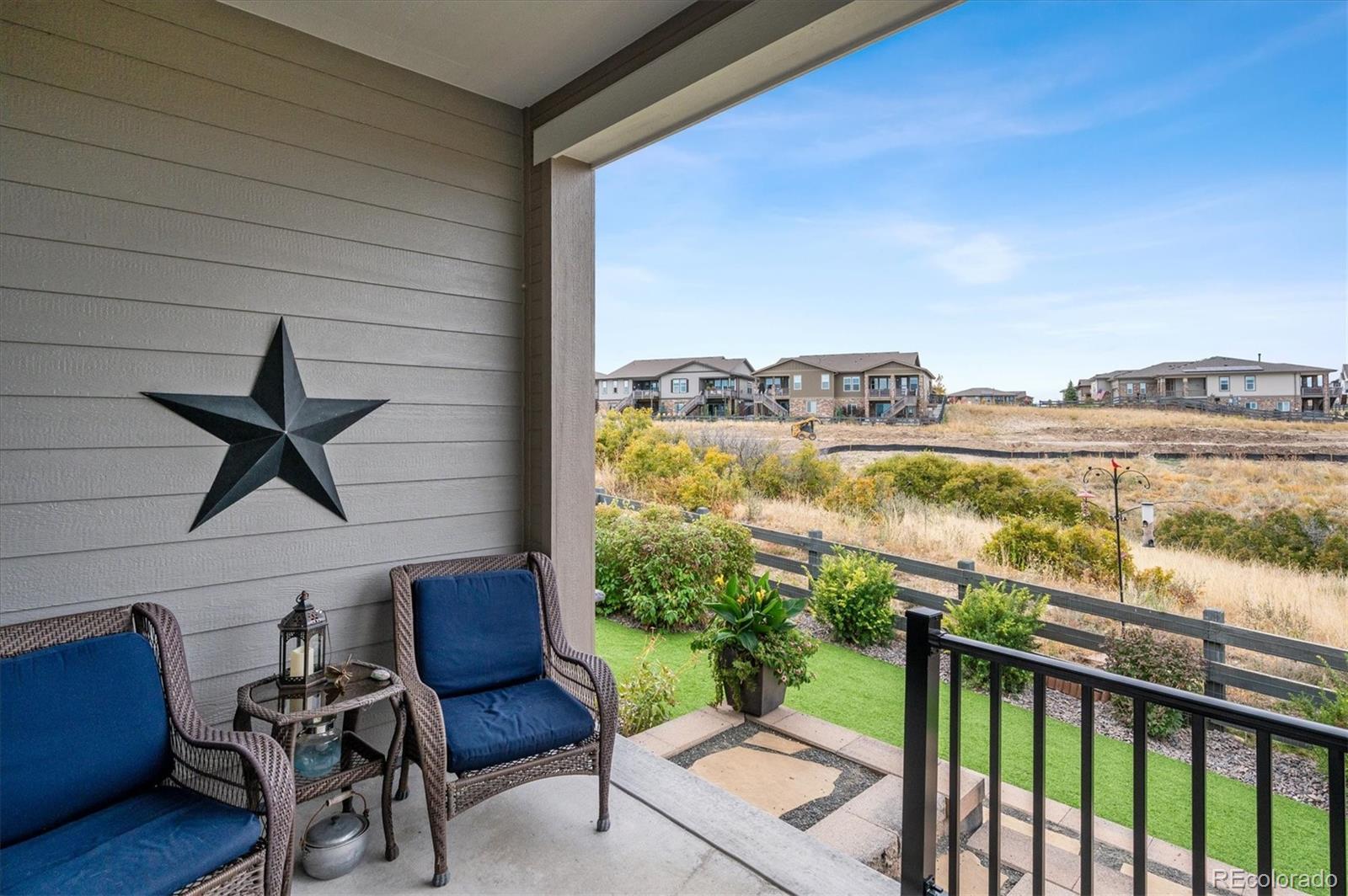 2095 Rim Ridge Drive Castle Pines, CO 80108 - Photo 37 of 46 a view of a balcony with chairs