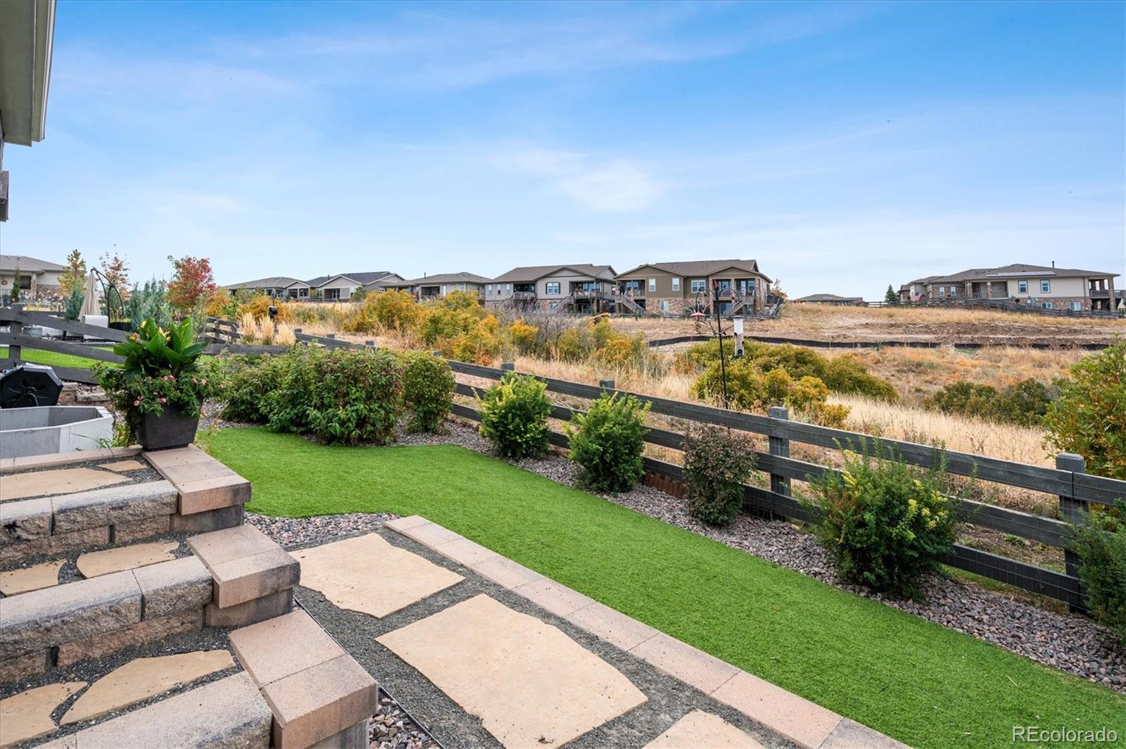 2095 Rim Ridge Drive Castle Pines, CO 80108 - Photo 39 of 46 a view of a city from a yard