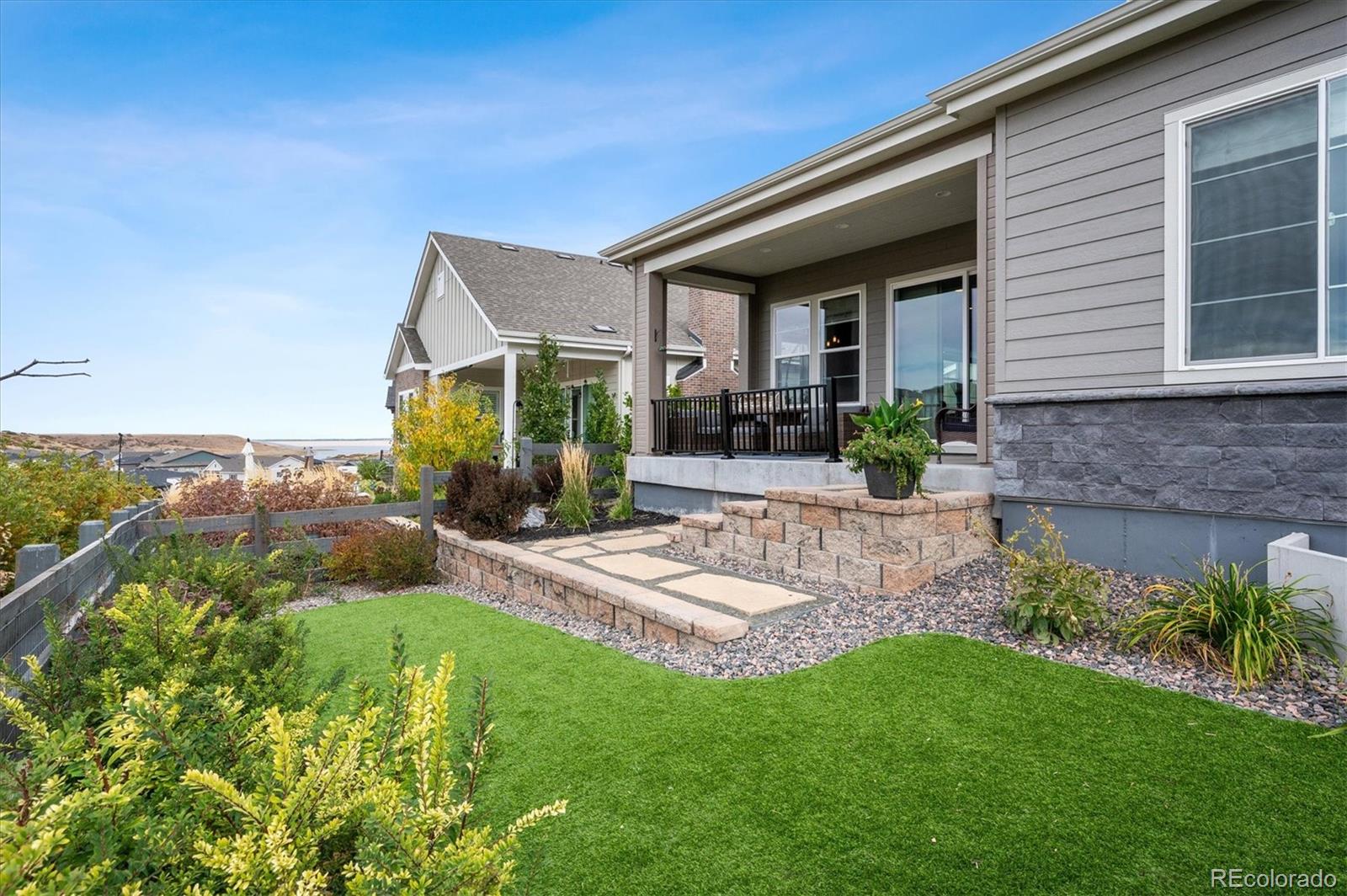 2095 Rim Ridge Drive Castle Pines, CO 80108 - Photo 40 of 46 a front view of a house with garden