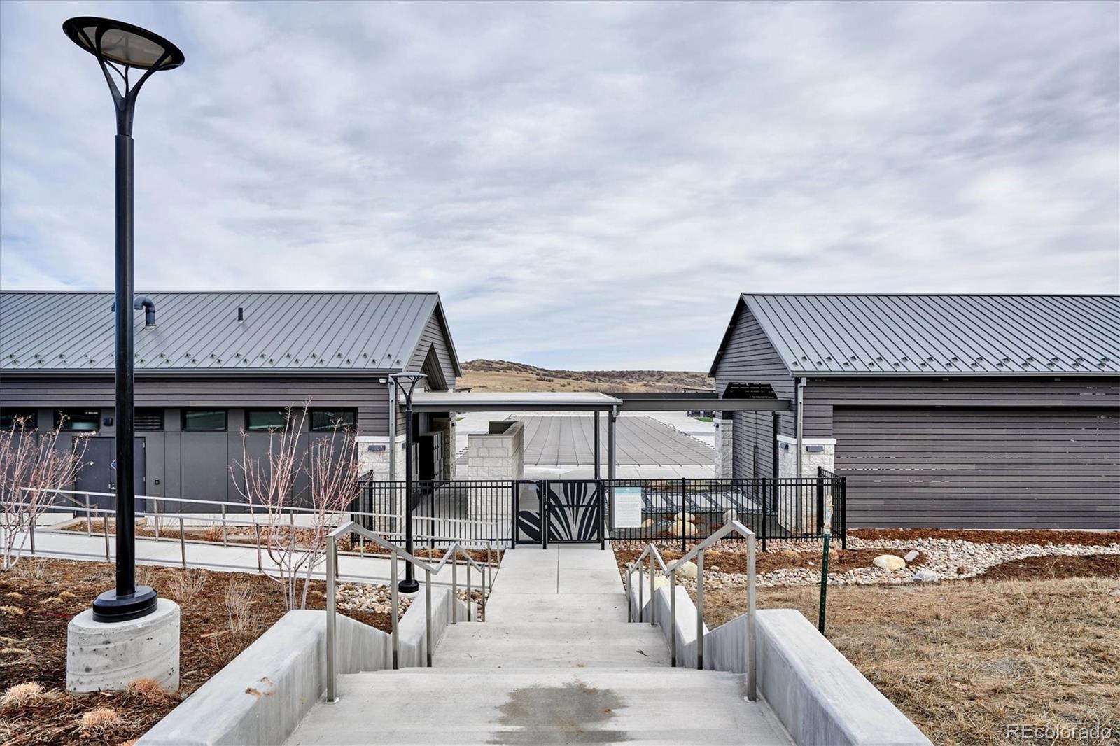 2095 Rim Ridge Drive Castle Pines, CO 80108 - Photo 46 of 46 a view of a house with swimming pool and sitting area
