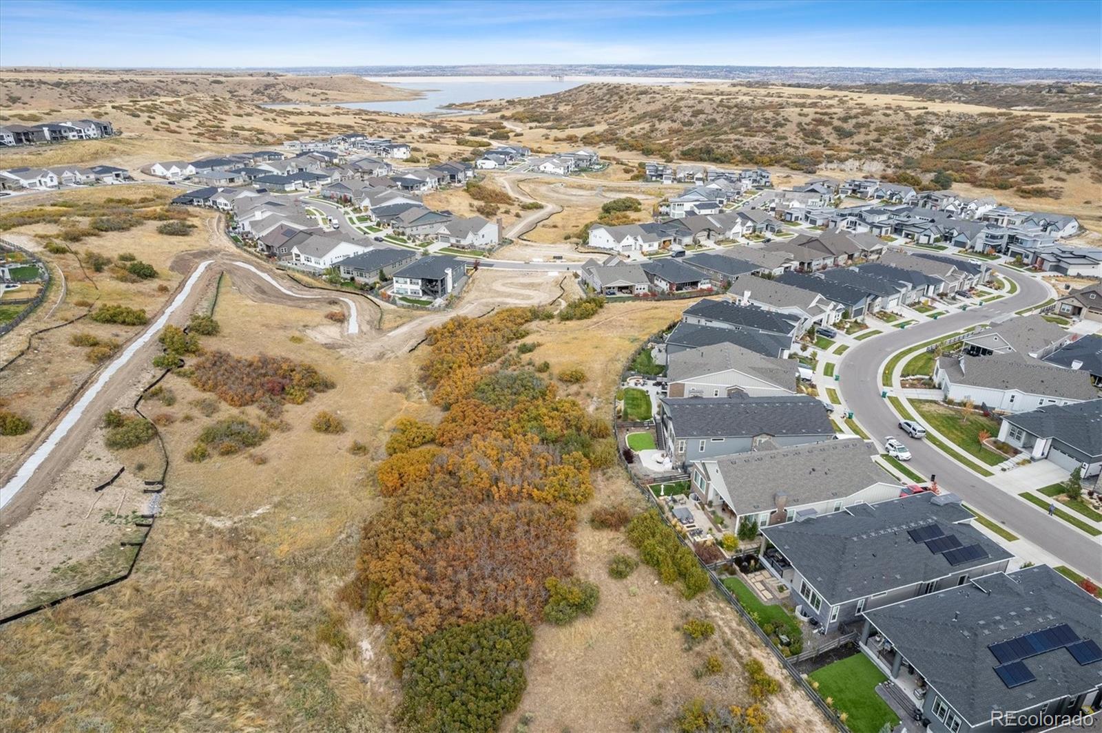 2095 Rim Ridge Drive Castle Pines, CO 80108 - Photo 5 of 46 an aerial view of residential houses with outdoor space