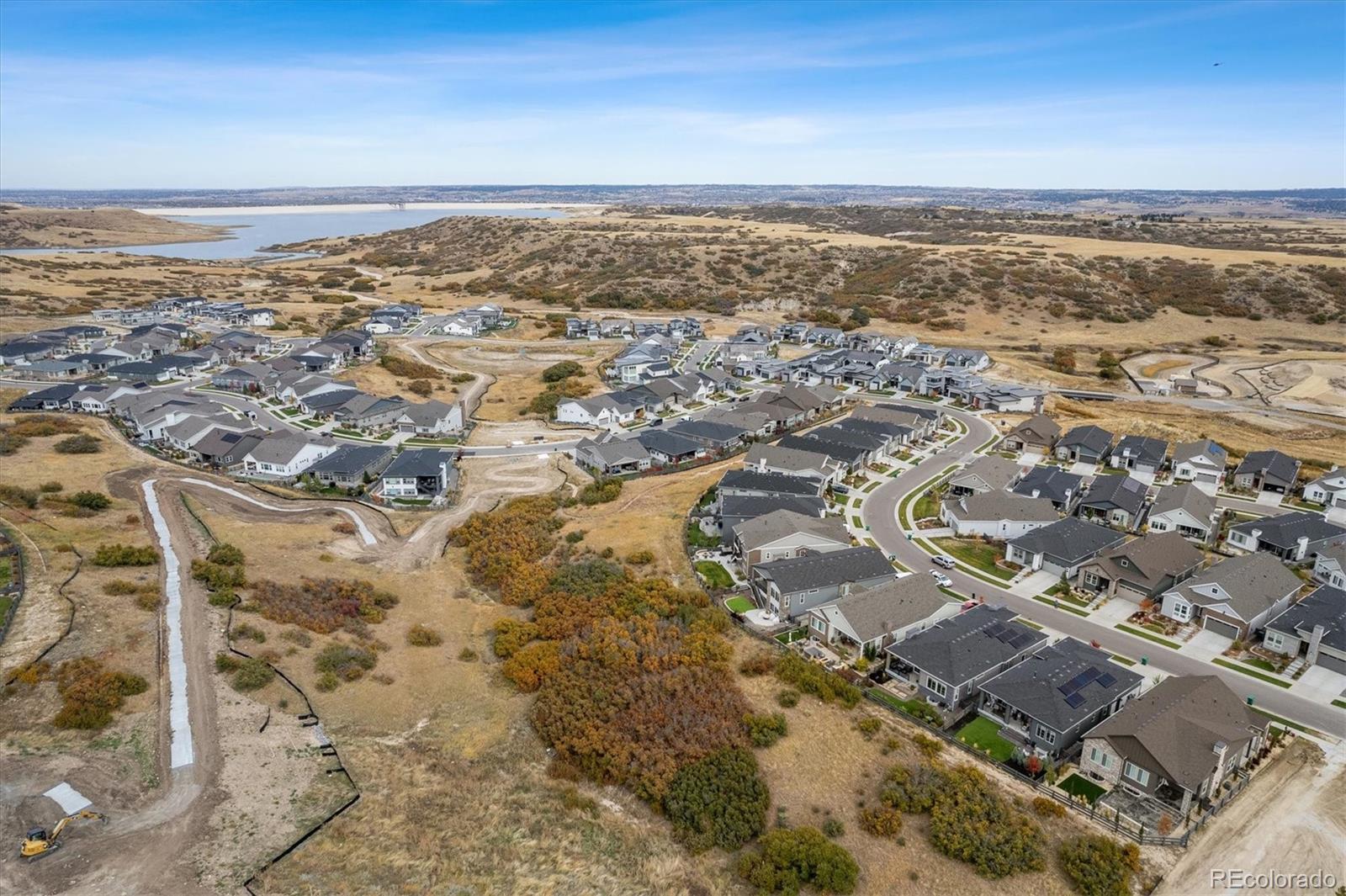 2095 Rim Ridge Drive Castle Pines, CO 80108 - Photo 6 of 46 an aerial view of residential building with an ocean