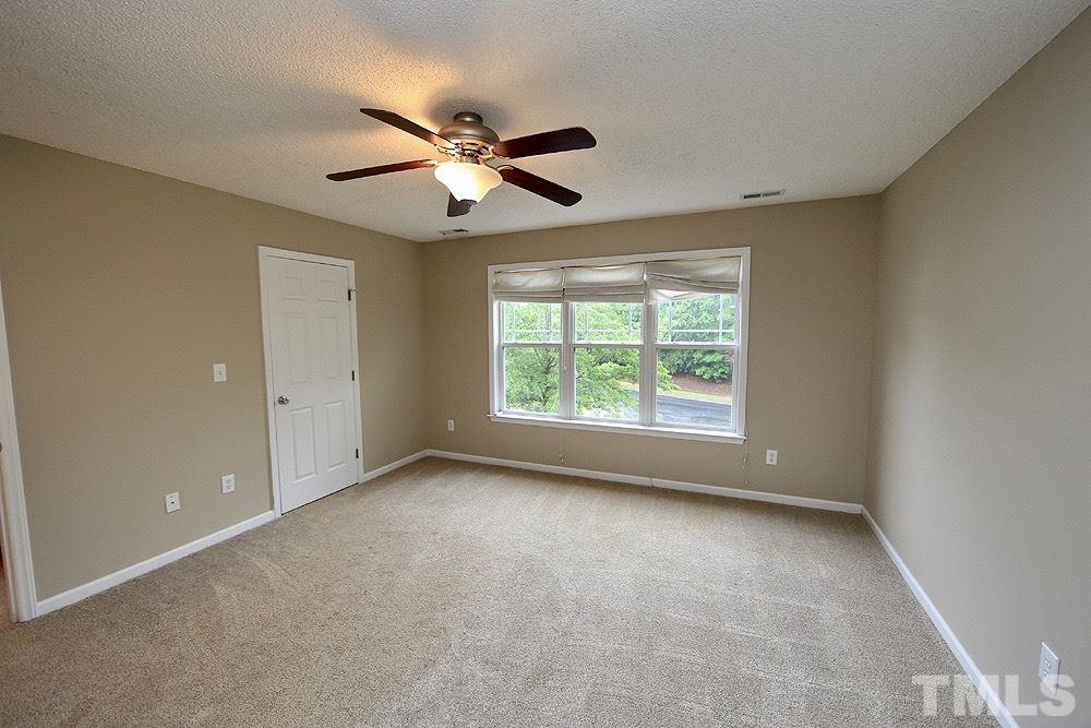 1009 Dual Parks Road Apex, NC 27502 - Photo 10 of 15 Spacious master bedroom with fresh neutral paint and nice walk in closet.