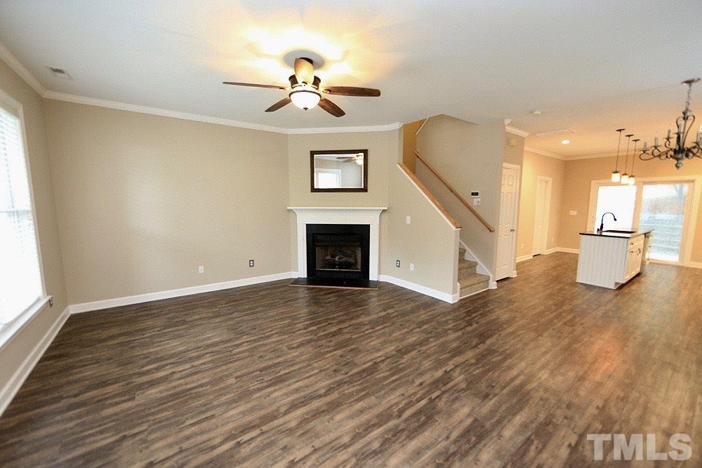 1009 Dual Parks Road Apex, NC 27502 - Photo 3 of 15 Bright and beautiful, this downstairs space is perfect for entertaining.