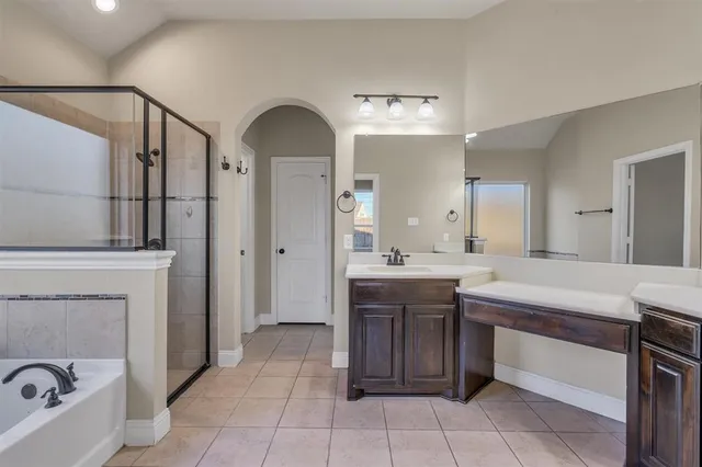 a bathroom with a sink a vanity and a mirror