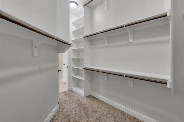 a view of an empty walk in closet
