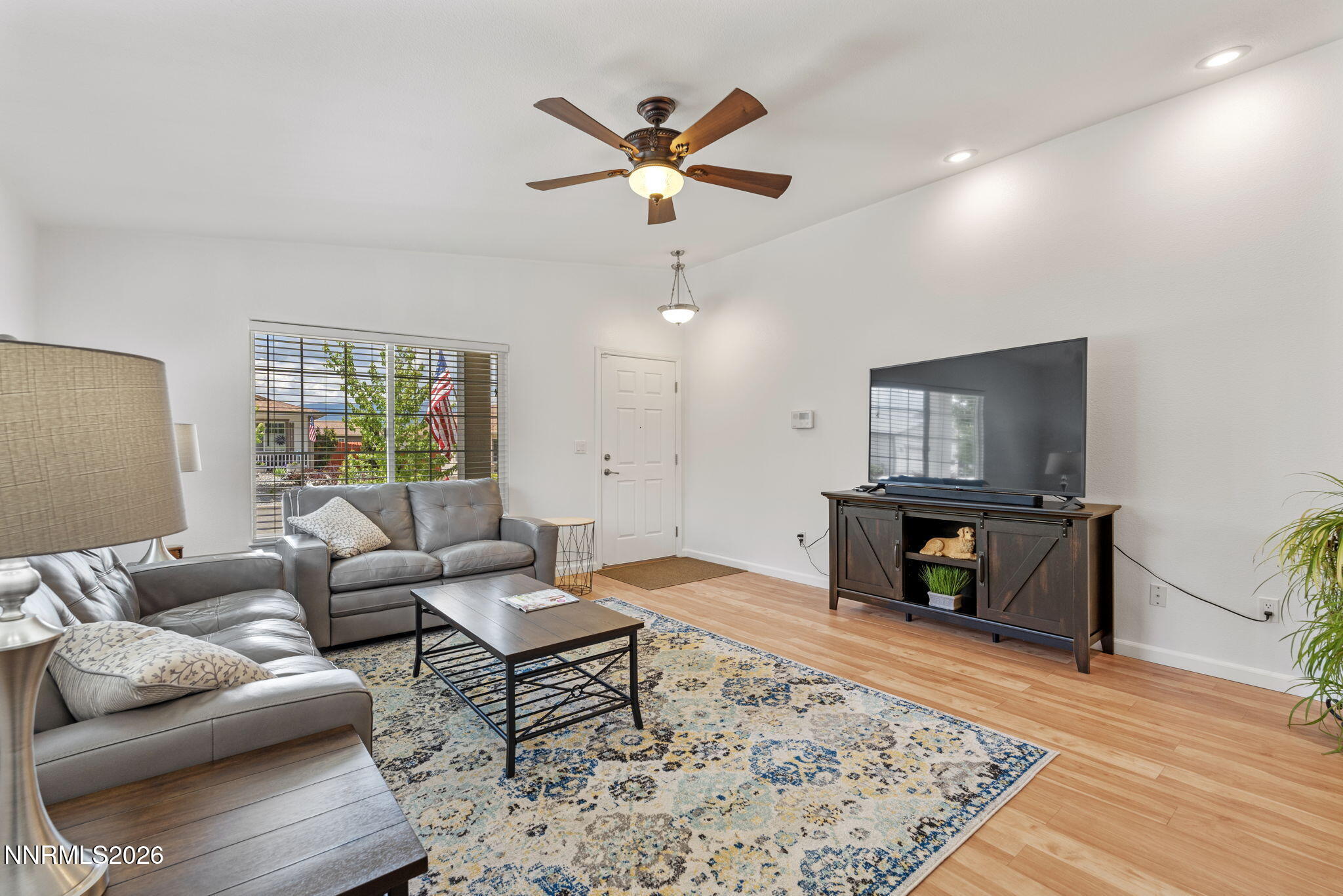 18324 Panda Bear Court Reno, NV 89508 - Photo 40 of 44 a living room with furniture and a wooden floor