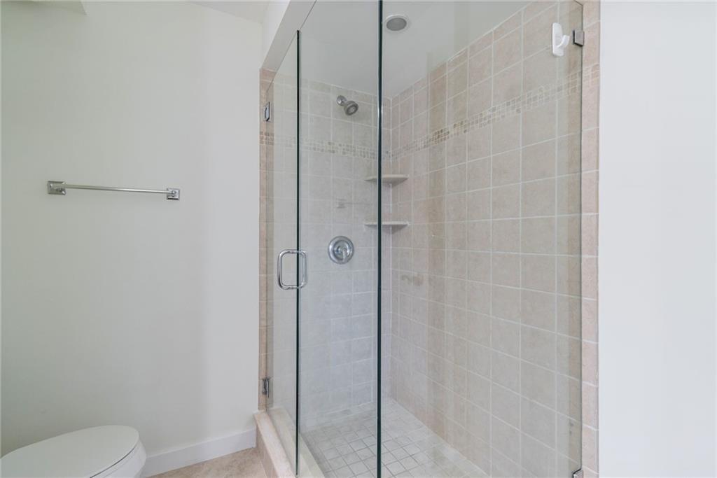 950 Ponce De Leon Road, Unit 408 Boca Raton, FL 33432 - Photo 12 of 51 a bathroom with a shower and toilet