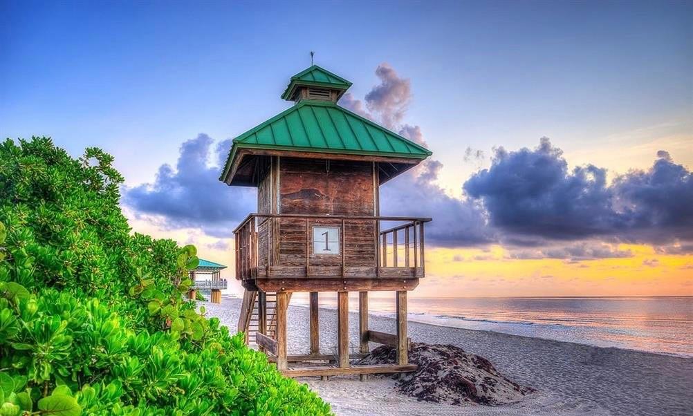 950 Ponce De Leon Road, Unit 408 Boca Raton, FL 33432 - Photo 50 of 51 a front view of a house with a yard
