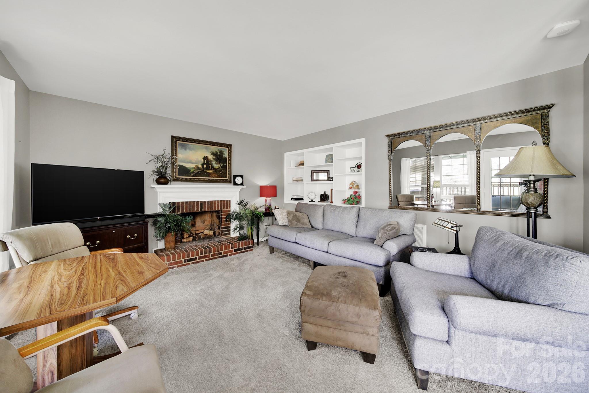263 Fox Hollow Road Mooresville, NC 28117 - Photo 13 of 44 a living room with furniture and a flat screen tv