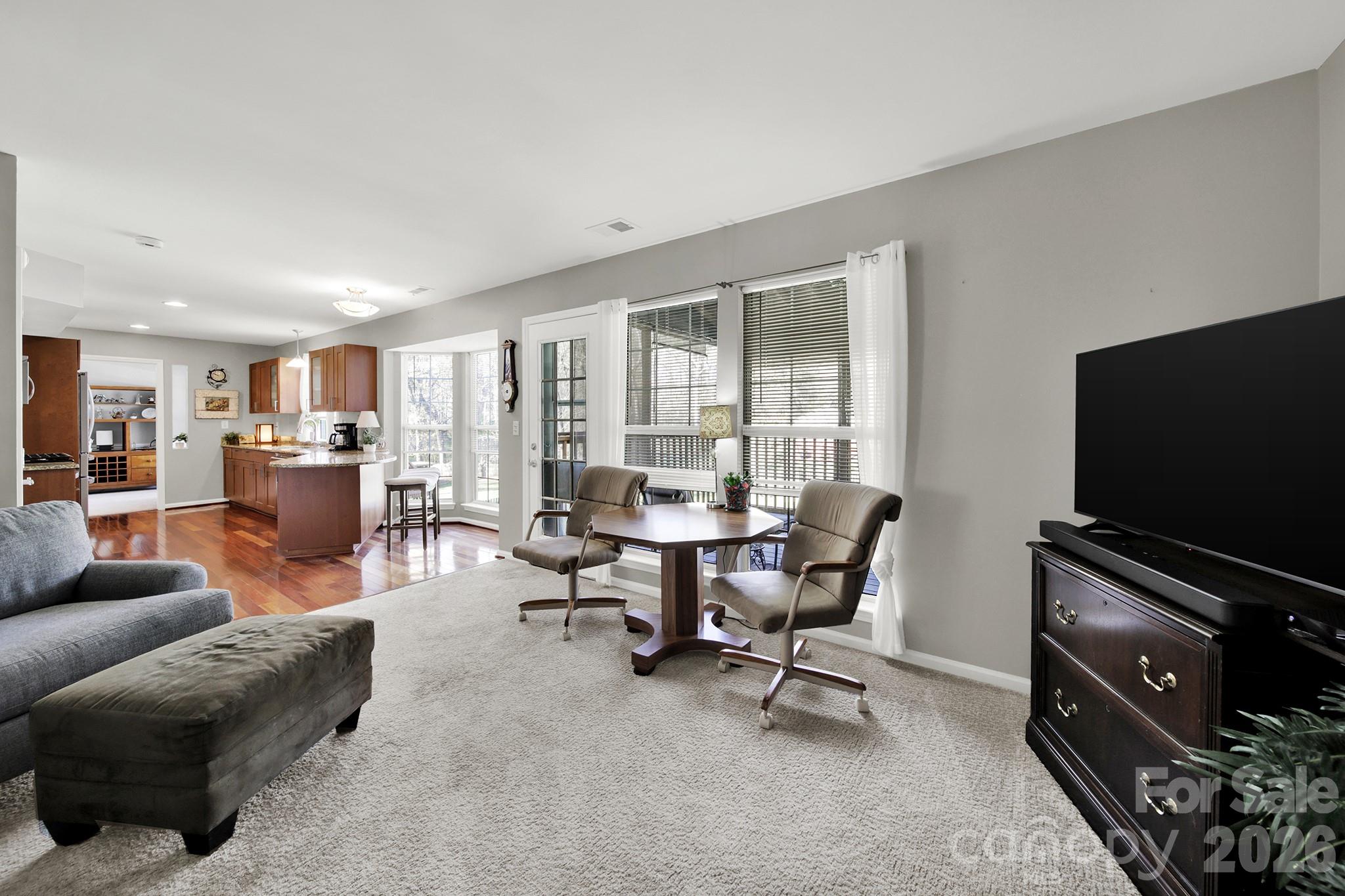 263 Fox Hollow Road Mooresville, NC 28117 - Photo 14 of 44 a living room with furniture and a flat screen tv