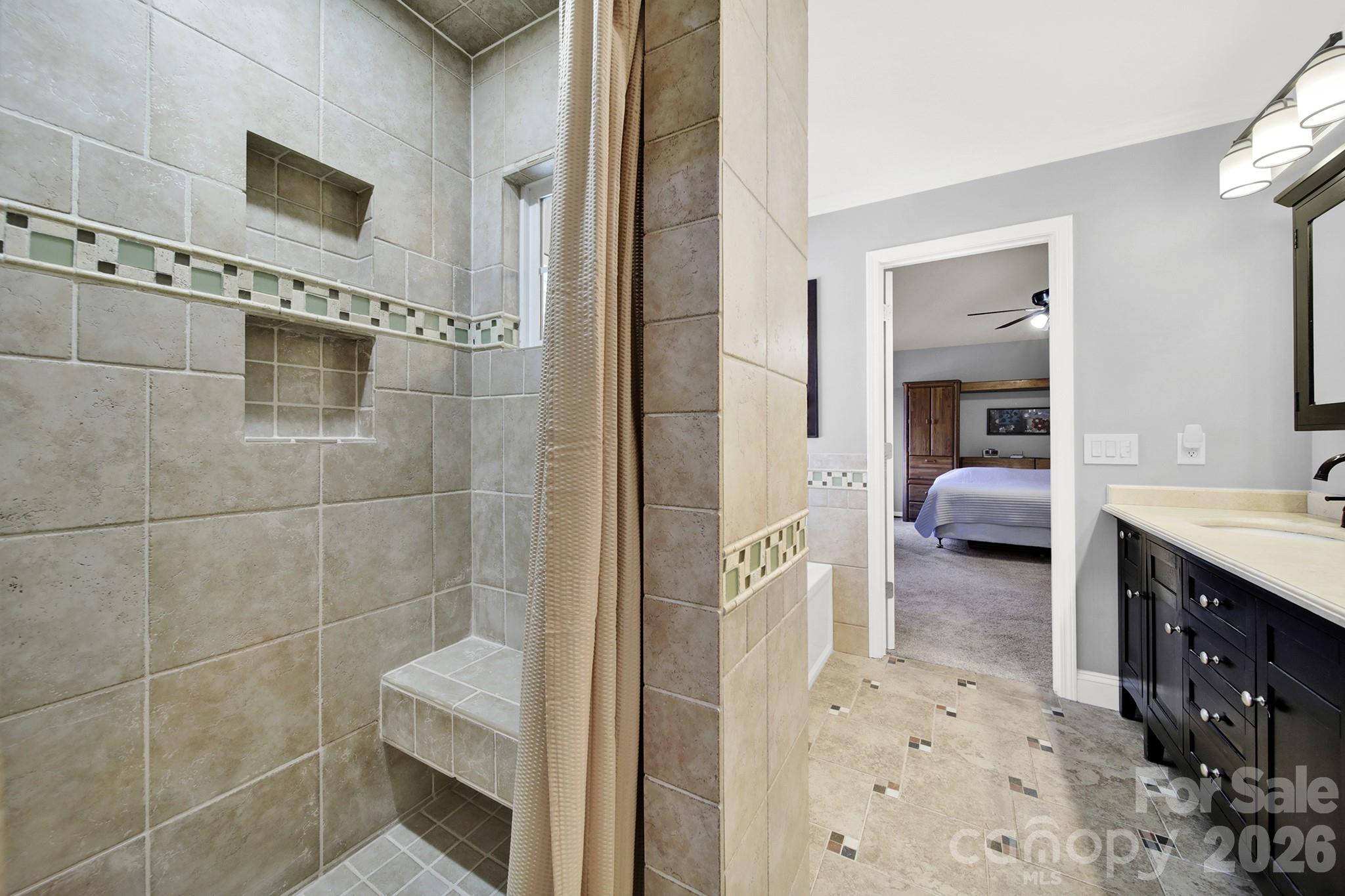 263 Fox Hollow Road Mooresville, NC 28117 - Photo 20 of 44 a en suite bathroom with a sink and a mirror