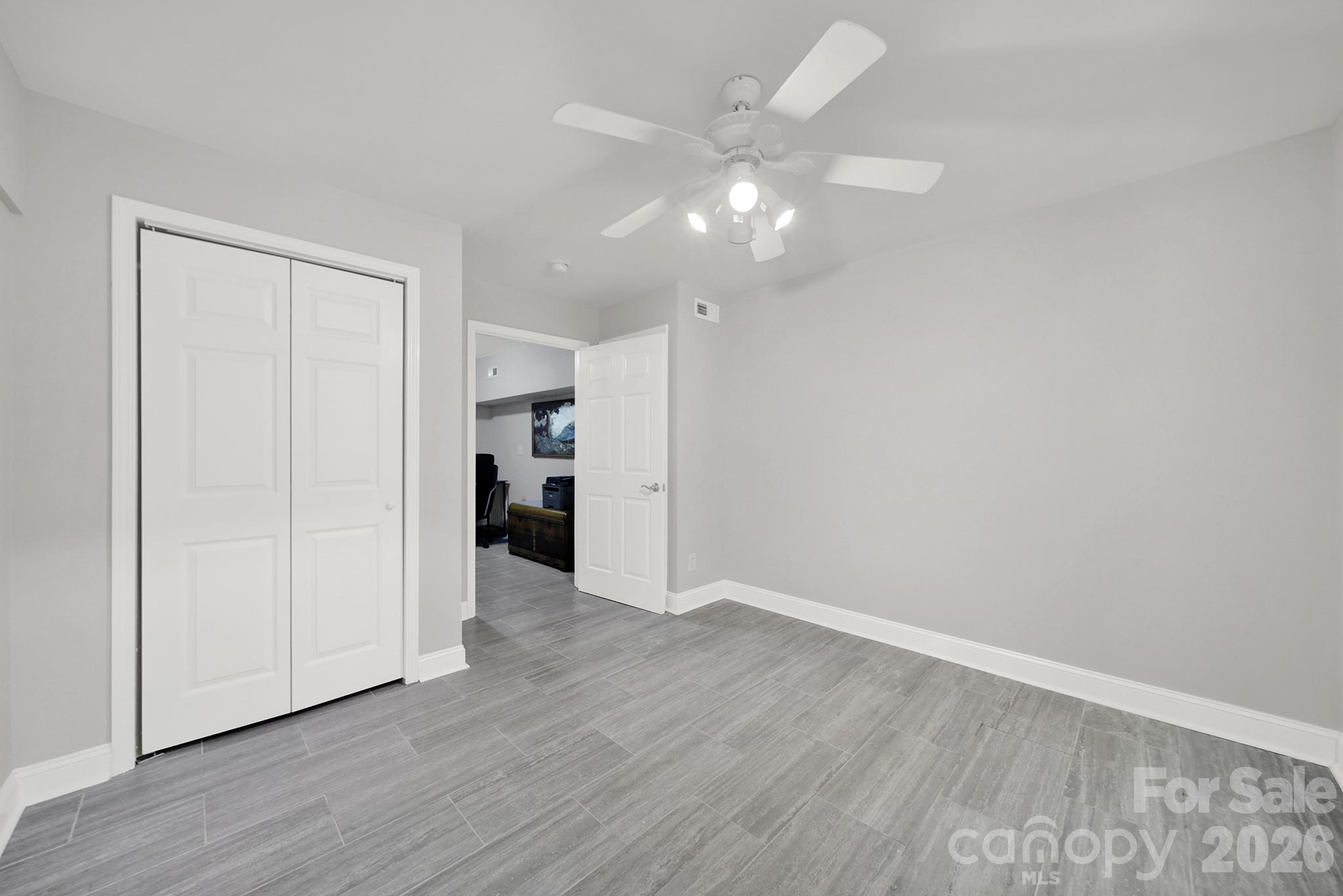 263 Fox Hollow Road Mooresville, NC 28117 - Photo 30 of 44 a view of an empty room with wooden floor