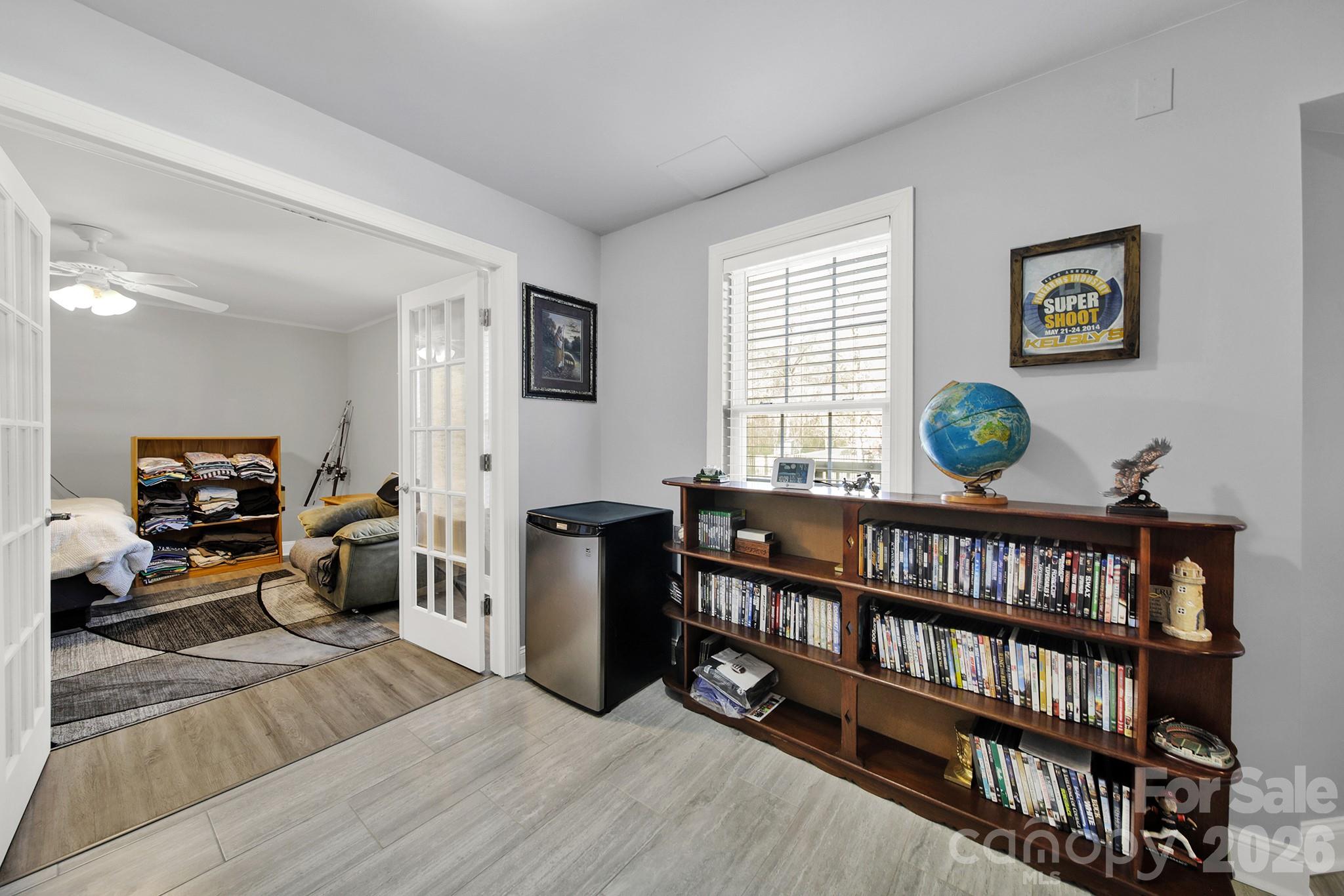 263 Fox Hollow Road Mooresville, NC 28117 - Photo 34 of 44 a living room with furniture and a book shelf