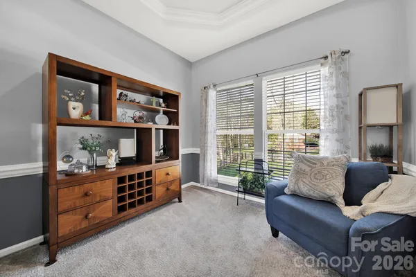 a living room with furniture and a window